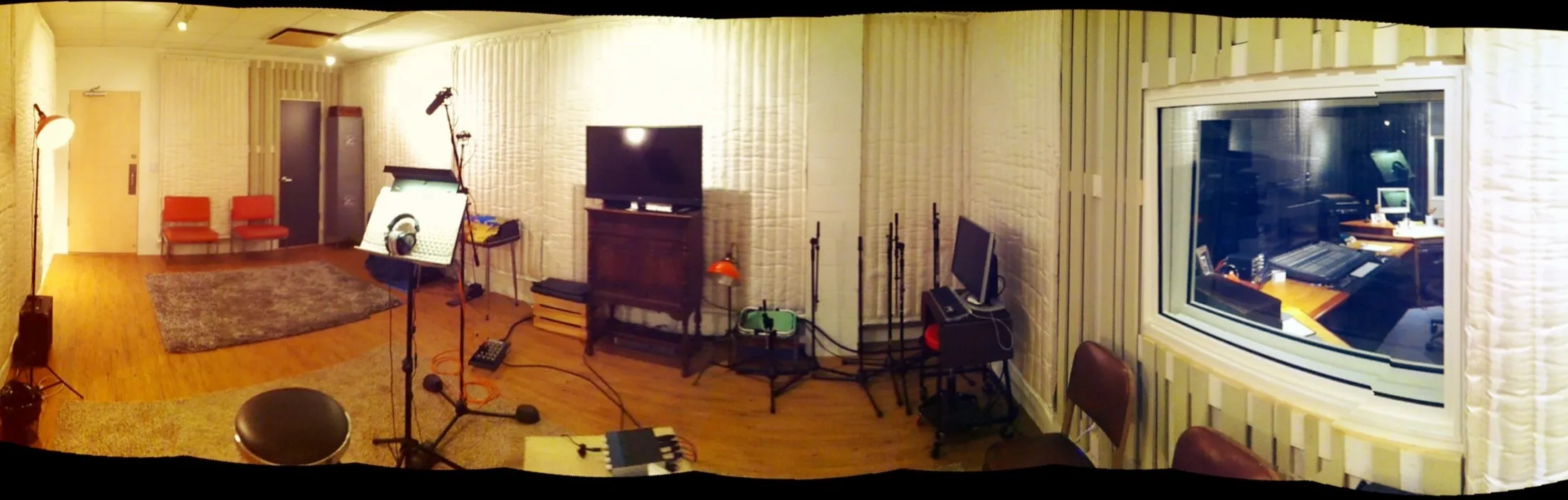 ADR room with microphone, picture monitor, and window into the control room
