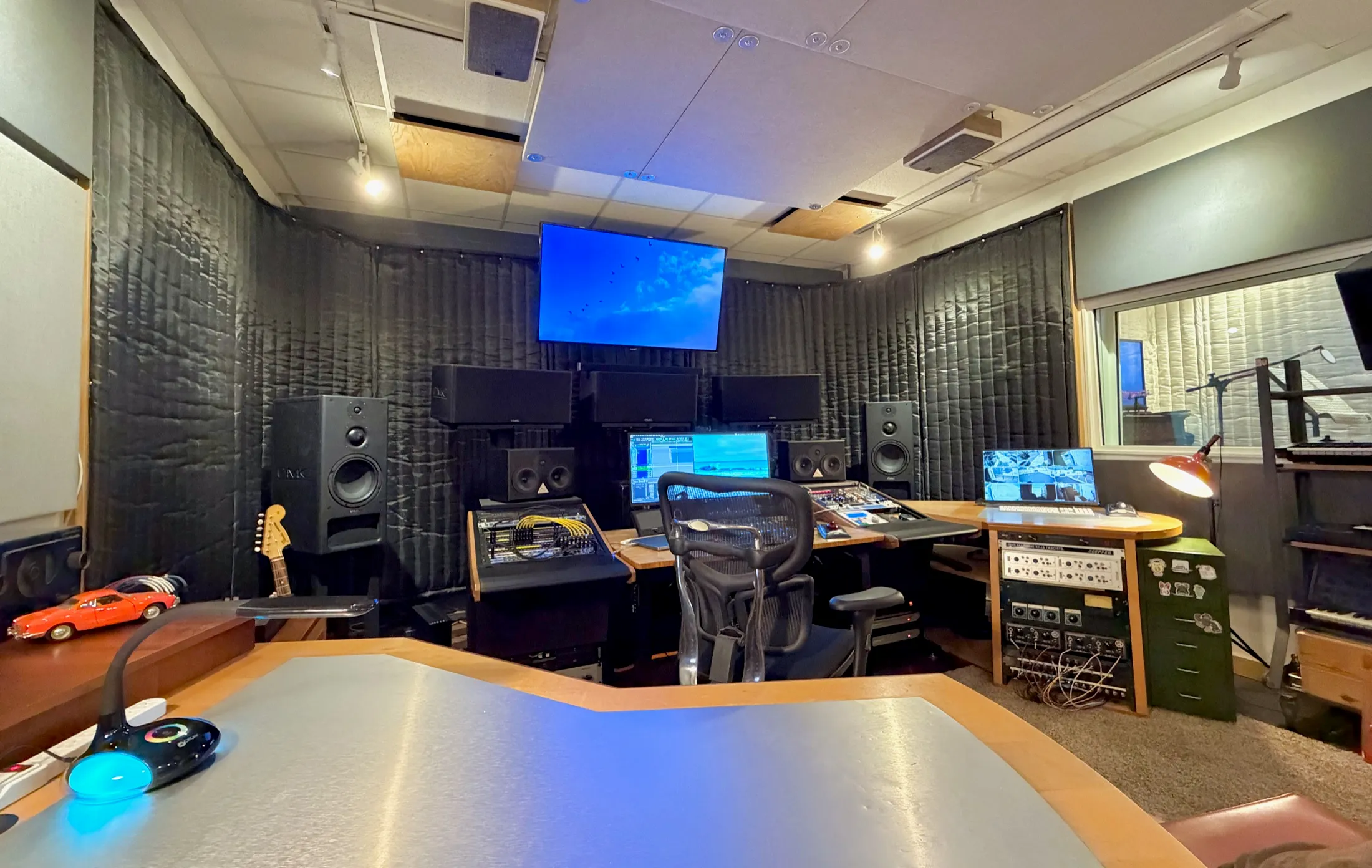 Client desk looking into the Atmos mix, with picture and console lit